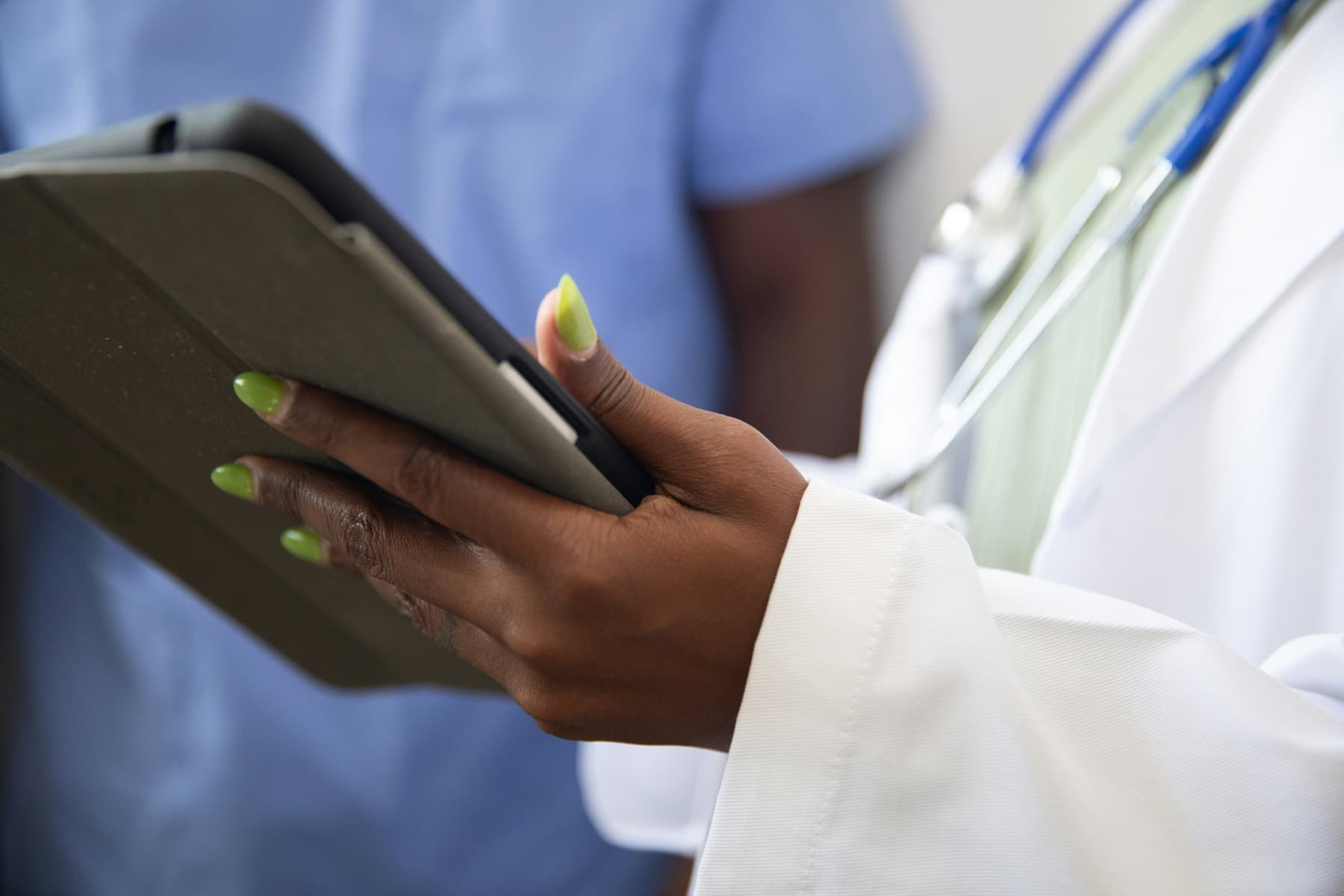 Clinician reviewing skin-health information on a tablet